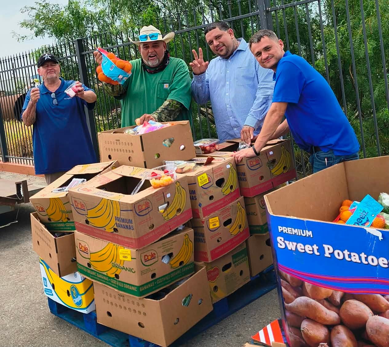 Volunteers with donated food boxes