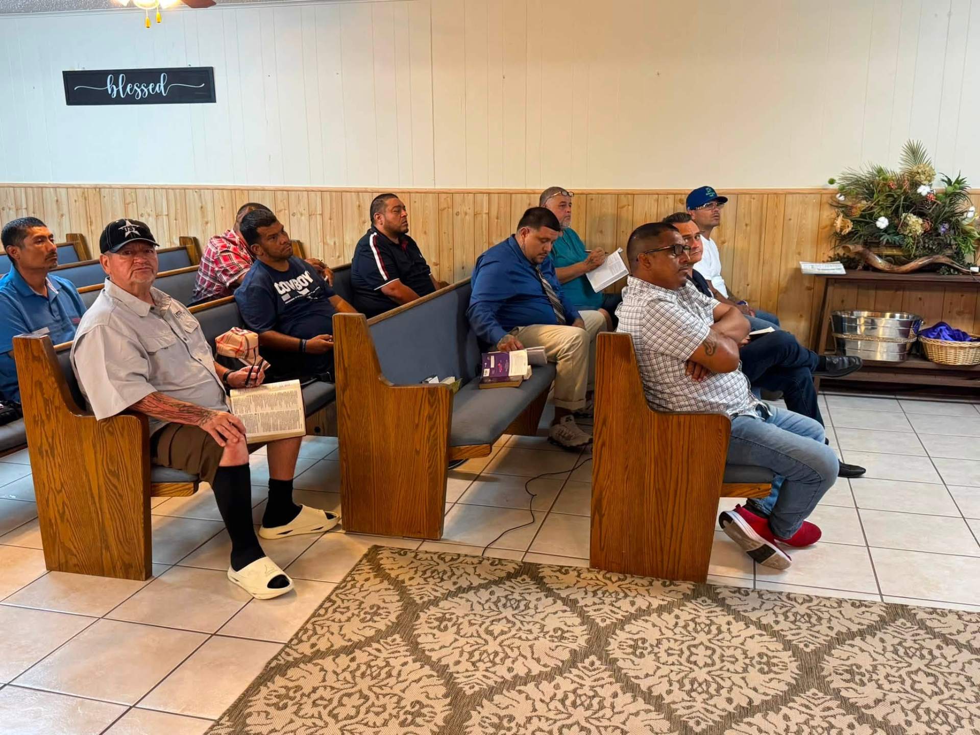 Men gathered in the chapel for service